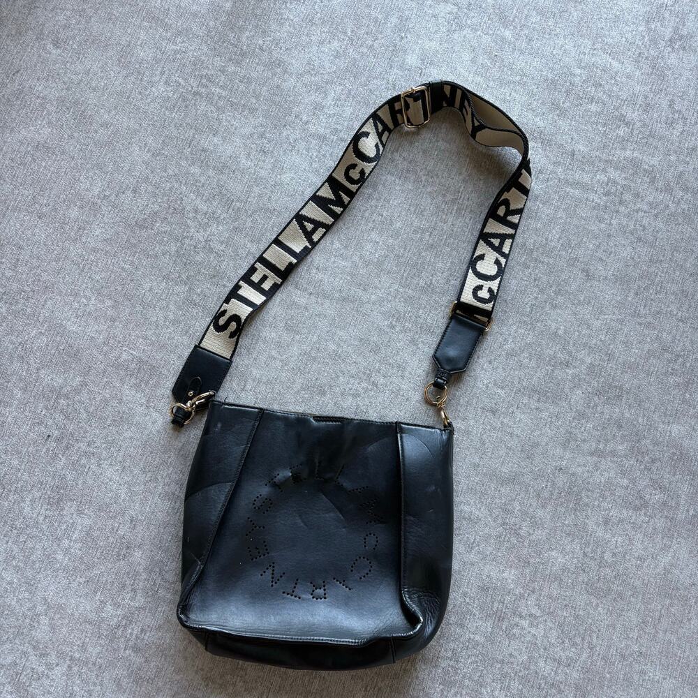$995 Stella McCartney Logo square crossbody bag in black faux leather